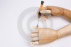 Wooden hands and screwdriver