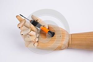 Wooden hands and screwdriver