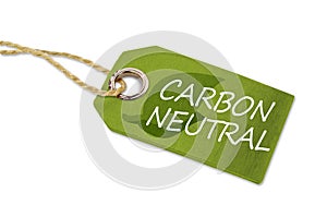 Wooden hang tag with leafs and carbon neutral photo