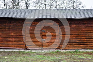 Wooden hangar barn in village, country stock