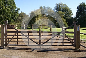 Wooden hard wood swing field gate with secure entry intercom system