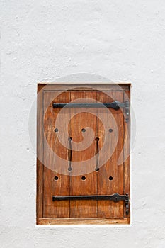 Wooden hatch window in a historic Cape Dutch building