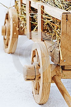 Wooden hay cart on a white background