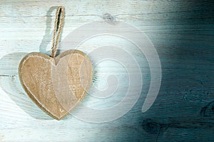 Wooden heart on blue board