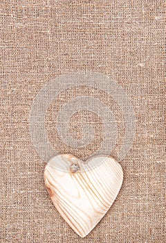 Wooden heart on the burlap