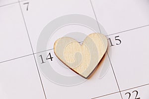 Wooden Heart on calendar. Valentine concept.