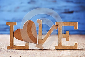 Wooden heart and letters forming the word love