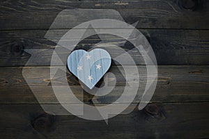 wooden heart with national flag of Federated States of Micronesia near reduce, reuse and recycle sing on the wooden background.