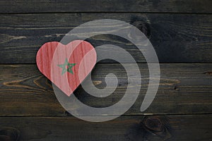 wooden heart with national flag of morocco on the wooden background