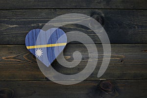 wooden heart with national flag of Nauru on the wooden background