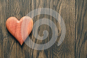 Wooden heart on oak table