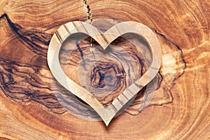 Wooden heart on wooden background, horicontal