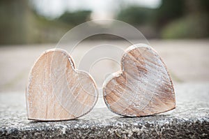 wooden hearts on granit in outdoor - Love concept