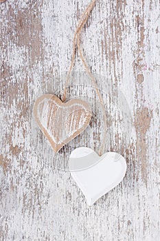 Wooden hearts on a white wooden background