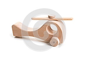 Wooden helicopter toy on white background