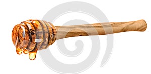 Wooden honey dipper with honey drop on white background