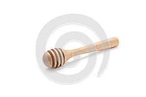 Wooden honey dipper isolated on white backgroiund.