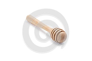 Wooden honey dipper isolated on white backgroiund.