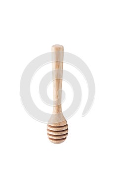 Wooden honey dipper isolated on white backgroiund.