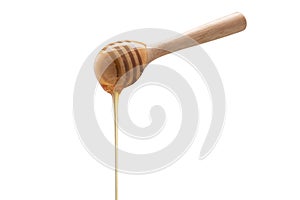 Wooden honey dipper isolated on white backgroiund.