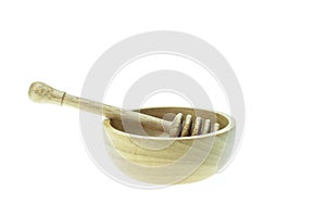 Wooden honey drizzler and bowl isolated on white background