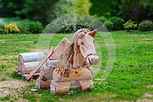 Wooden horse landscape design. Lovingly decorated the area with plants and flowers