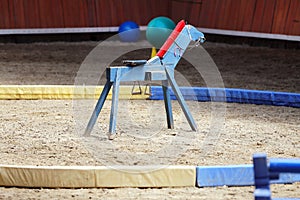 Wooden horse made for children in rural animal farm waiting young riders