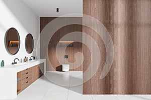 Wooden hotel bathroom interior with double sink and toilet, empty wall