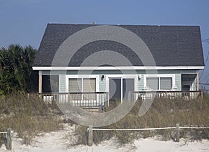 Wooden house on beach background