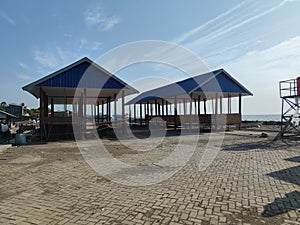 wooden house on the beach?midday wheather