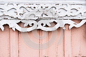 Wooden house with beautiful carved platbands. Wooden Texture and background