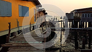 Wooden house and bridge in the fisheries village in Thailand