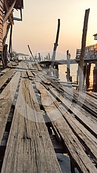 Wooden house and bridge in the fisheries village in Thailand