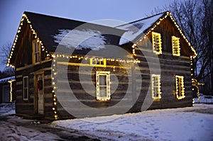 Wooden house decorated with Christmas lights