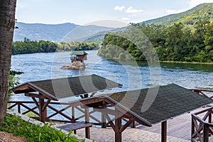 Wooden house on the Drina river near Bajina Basta in Serbia photo