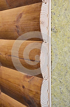 Wooden house facade wall layer with mineral wool, rock wool insulation. House insulation wall layers