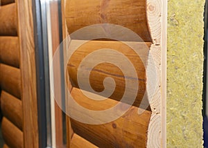 Wooden house facade wall with mineral wool, rock wool insulation. House insulation wall layers photo