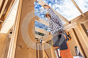 Wooden House Frame Building by Contractor Worker