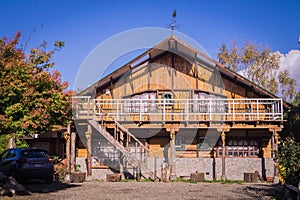 Wooden house with gallery and a balcony in the Chilean countryside in the south of the country