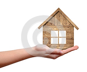 Wooden house in hand