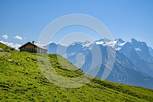 Wooden house with incredible views on Wetterhorn peak in Swiss Alps