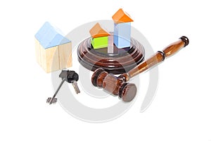 Wooden house and judge gavel on a white background. Is isolated