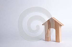 Wooden house with a large doorway on a white background. The concept of buying and selling real estate, rental housing. Affordable