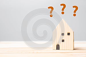 Wooden house model on table background. Home, Crisis, Economic recession, Homeless, Real Estate, Buy or Rent and Property concept