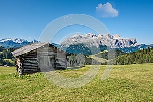 Wooden house in mountain landscape of alto adige, italy