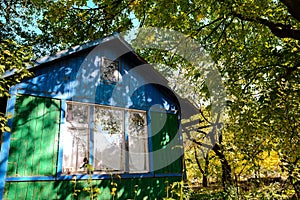 Wooden house for rest with a sauna and the big wooden font