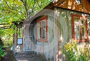 Wooden house for rest with a sauna and the big wooden font