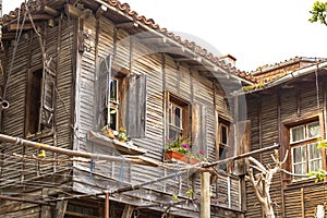 Wooden house with retro windows and shutters in Bulgaria