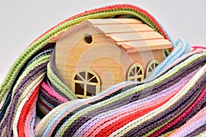 Wooden house sheltered with a scarf photo