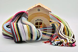 Wooden house sheltered with a scarf photo